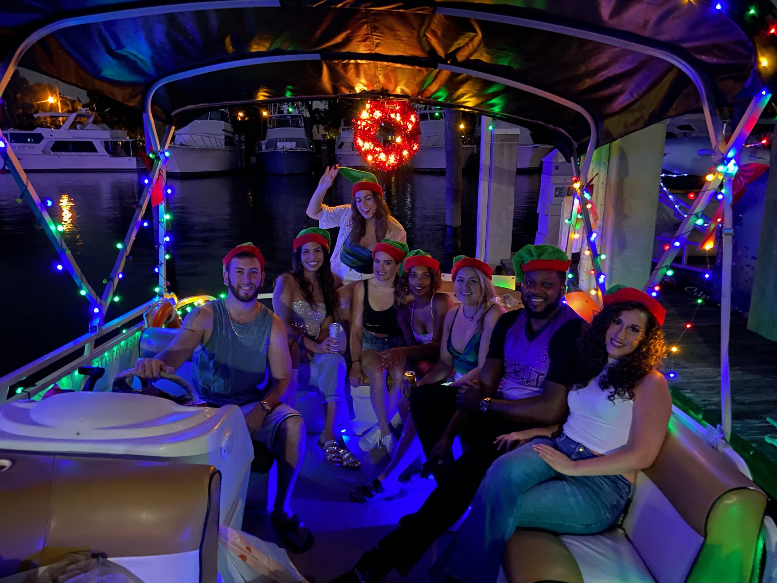 Guests enjoying the Fort Lauderdale holiday lights boat tour at night